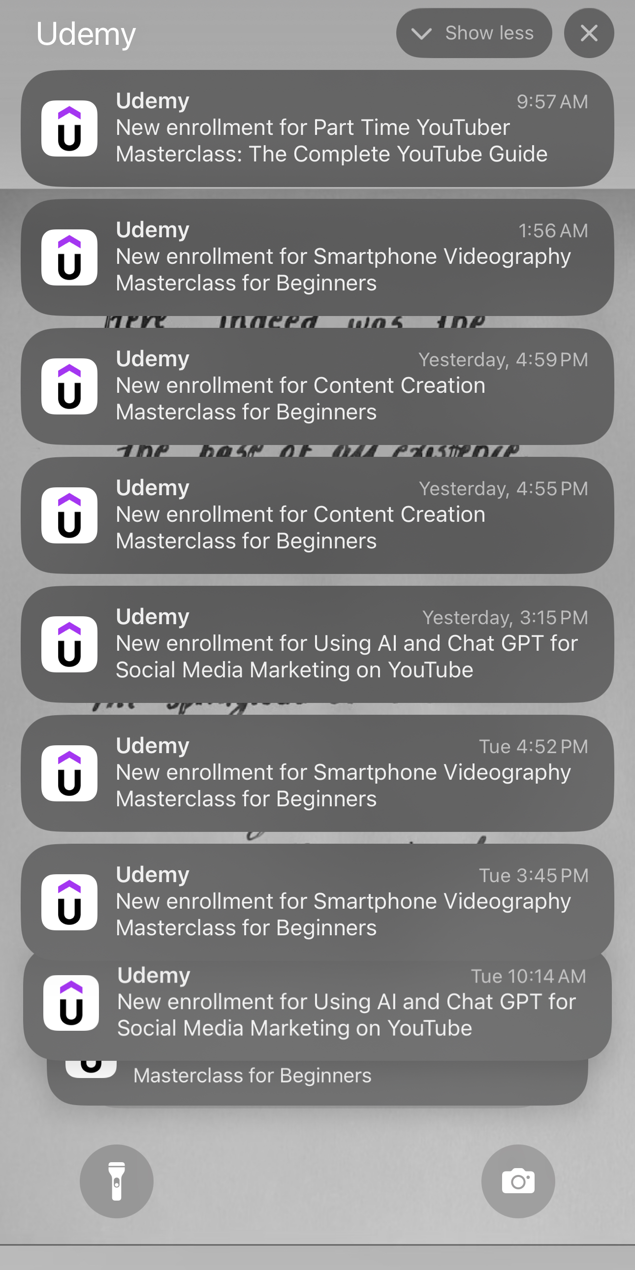 iPhone notification centre showing a stream of new Udemy enrollment alerts across multiple courses